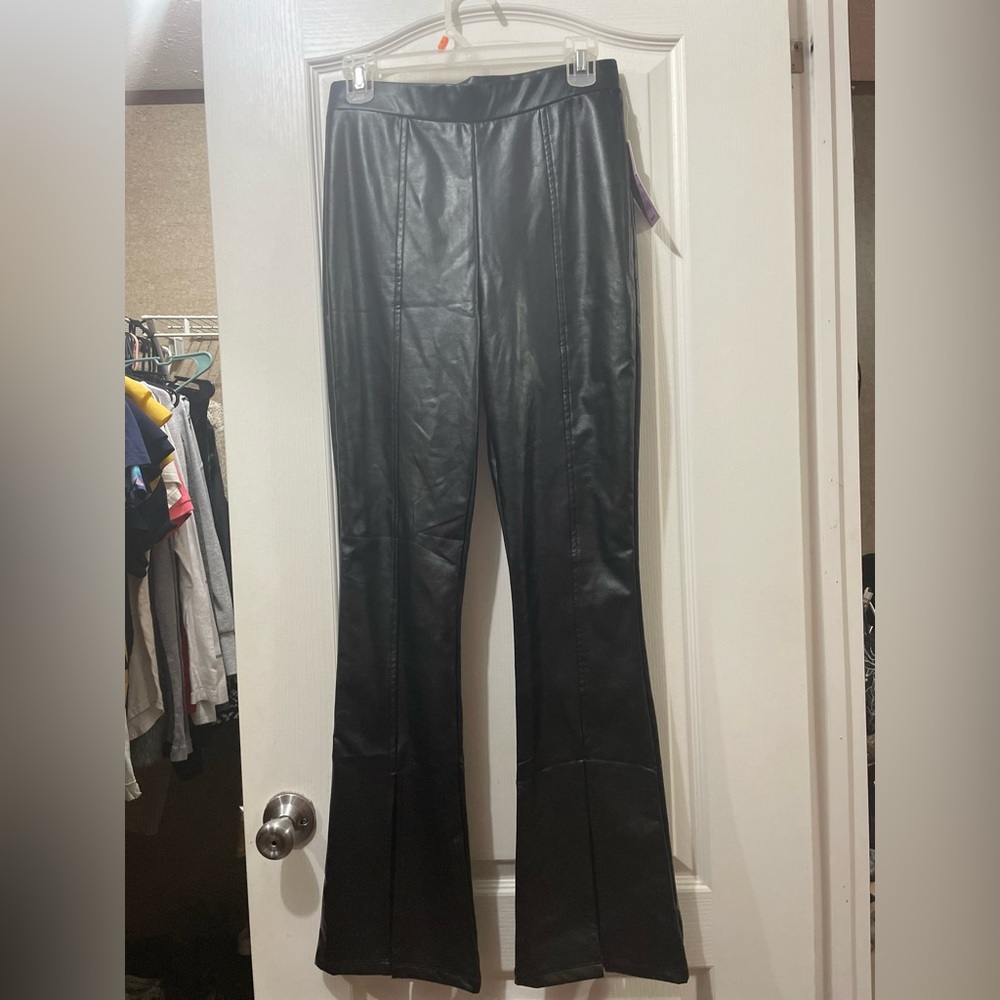 Black leather pants with bell bottoms splits
